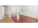 Open-concept living room featuring hardwood floors and archways to adjacent room at 10142 Serotina Ct, Orlando, FL 32832
