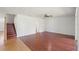 Open-concept living area features wood floors and staircase at 10142 Serotina Ct, Orlando, FL 32832