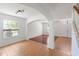 Bright living room showcasing hardwood floors, archways, and natural light at 10142 Serotina Ct, Orlando, FL 32832