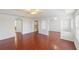 Spacious living room with archways, wood floors, and a ceiling fan at 10142 Serotina Ct, Orlando, FL 32832