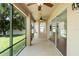 Screened patio features ceiling fans and views of the spacious backyard at 10142 Serotina Ct, Orlando, FL 32832