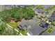 Aerial view showcasing a beautiful home with a private pool and lush landscaping in a desirable neighborhood at 102 Hammock Preserve Loop, Winter Garden, FL 34787