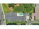 Aerial view of a modern home featuring a backyard swimming pool, sleek design, and well-maintained landscaping at 102 Hammock Preserve Loop, Winter Garden, FL 34787