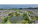 Breathtaking aerial view showcasing the community's lush landscape, lake, pool and the beautiful waterfront at 102 Hammock Preserve Loop, Winter Garden, FL 34787