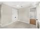 Bright bedroom with plush carpet, closet, and a modern ceiling fan at 102 Hammock Preserve Loop, Winter Garden, FL 34787