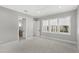 Bright bedroom featuring a ceiling fan, plush carpet, neutral walls, and three bright windows at 102 Hammock Preserve Loop, Winter Garden, FL 34787