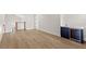 Bonus room with wood floors, bar and wine fridge, providing a luxurious living space at 102 Hammock Preserve Loop, Winter Garden, FL 34787