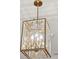 A close-up view of a gold butterfly-themed chandelier at 102 Hammock Preserve Loop, Winter Garden, FL 34787