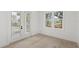 Bright flex room featuring wood floors, natural light, and access to a pool area at 102 Hammock Preserve Loop, Winter Garden, FL 34787