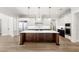Modern kitchen showcasing stainless steel appliances, a large island, and custom cabinetry perfect for any chef at 102 Hammock Preserve Loop, Winter Garden, FL 34787