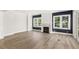 Bright living room with fireplace and large windows at 102 Hammock Preserve Loop, Winter Garden, FL 34787