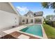 Private backyard pool featuring a sun deck and a covered patio ideal for outdoor entertaining and relaxation at 102 Hammock Preserve Loop, Winter Garden, FL 34787