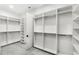 Walk-in closet with custom shelves and hanging rods for optimal storage at 102 Hammock Preserve Loop, Winter Garden, FL 34787
