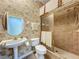 Unique bathroom with a pedestal sink, toilet, and tiled shower with glass doors at 106 Winghurst Blvd, Orlando, FL 32828