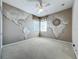 Unique bedroom features a world map mural and a ceiling fan for added comfort at 106 Winghurst Blvd, Orlando, FL 32828