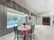 Breakfast nook features a table and chairs and overlooks a backyard with a water view at 106 Winghurst Blvd, Orlando, FL 32828