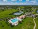 Aerial view of community pool, tennis courts, and recreational amenities surrounded by lush greenery at 106 Winghurst Blvd, Orlando, FL 32828