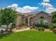 Charming single-Gathering home with manicured lawn and beautiful landscaping at 106 Winghurst Blvd, Orlando, FL 32828