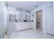 Elegant bathroom with marble tile, dual sinks, and a glass enclosed shower at 1097 Trappers Trail Loop, Davenport, FL 33896