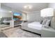 Elegantly designed bedroom featuring stylish decor, modern lighting, and a dressing table, maximizing comfort at 1097 Trappers Trail Loop, Davenport, FL 33896