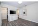 This bedroom features a modern dresser, and a mirror opposite the closet, with a TV on the dresser at 1097 Trappers Trail Loop, Davenport, FL 33896
