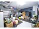 Organized garage with ample storage space, including shelving and a designated workout area at 1097 Trappers Trail Loop, Davenport, FL 33896