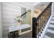 Stylish hallway featuring a mirror, console table with decor, and a staircase at 1097 Trappers Trail Loop, Davenport, FL 33896