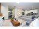 Bright and airy living space with modern furnishings and an open layout to the kitchen at 1097 Trappers Trail Loop, Davenport, FL 33896