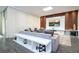 Spacious living room with a modern entertainment center, comfortable seating, and tasteful decor at 1097 Trappers Trail Loop, Davenport, FL 33896
