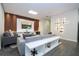 Modern living room with contemporary decor, including a stylish entertainment center and sleek lighting at 1097 Trappers Trail Loop, Davenport, FL 33896
