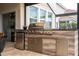 Outdoor grill area with stainless steel appliances and a wood style cabinet at 1097 Trappers Trail Loop, Davenport, FL 33896