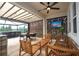 Inviting outdoor living space with a covered patio, seating, and outdoor television at 1097 Trappers Trail Loop, Davenport, FL 33896