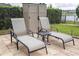 Patio area with lake view, chaise lounges and outdoor storage at 1097 Trappers Trail Loop, Davenport, FL 33896