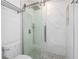 Walk-in shower with tiled walls, rainfall shower head, and shower controls at 1097 Trappers Trail Loop, Davenport, FL 33896