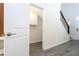 Storage area under staircase and entryway, perfect for storing coats, shoes, and other items at 1097 Trappers Trail Loop, Davenport, FL 33896