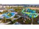 Community waterpark featuring a tall water slide, splash pad, and kid-friendly play structures at 1097 Trappers Trail Loop, Davenport, FL 33896