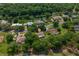 Aerial view of home with mature landscaping in desirable area near water feature at 1111 Pinar Dr, Orlando, FL 32825