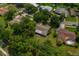 Aerial view of a home with mature landscaping and a serene backyard at 1111 Pinar Dr, Orlando, FL 32825