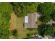 Aerial view of home showcasing landscaping and proximity to surrounding greenery at 1111 Pinar Dr, Orlando, FL 32825