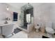 Luxury bathroom features freestanding tub, glass shower, and sleek fixtures at 1111 Pinar Dr, Orlando, FL 32825