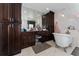 Elegant bathroom with dual vanities, freestanding tub, and classic fixtures at 1111 Pinar Dr, Orlando, FL 32825