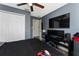 Comfortable bedroom with neutral walls, ceiling fan, and closet space at 1111 Pinar Dr, Orlando, FL 32825