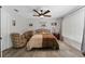 This bedroom features a ceiling fan and two armchairs at 1111 Pinar Dr, Orlando, FL 32825