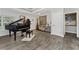 Elegant entryway featuring tiled floors, black piano, and neutral wall colors, creating a welcoming ambiance at 1111 Pinar Dr, Orlando, FL 32825