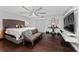 Serene main bedroom with dark wood floors, seating, and ample natural light at 1111 Pinar Dr, Orlando, FL 32825