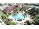 The aerial view of the community pool highlights its resort style amenities and gorgeous landscaping at 12016 Villanova Dr # 102, Orlando, FL 32837