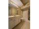 Bathroom featuring a single sink vanity, large mirror, and shower-tub combo at 12016 Villanova Dr # 102, Orlando, FL 32837