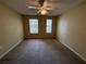 Spacious bedroom with neutral walls, carpet floors, and a ceiling fan at 12016 Villanova Dr # 102, Orlando, FL 32837