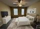 Cozy bedroom with ceiling fan, carpet, neutral color scheme and natural light from two windows at 12016 Villanova Dr # 102, Orlando, FL 32837
