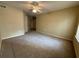 Bedroom with two closets, neutral walls, and carpet flooring at 12016 Villanova Dr # 102, Orlando, FL 32837